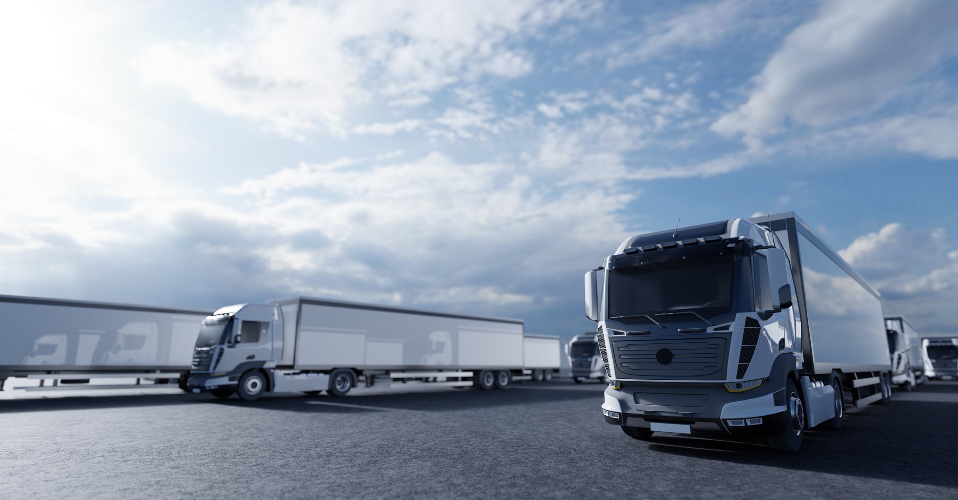 rows-of-semi-trucks-parked-under-cloudy-sky-2026-03-25-00-00-11-utc